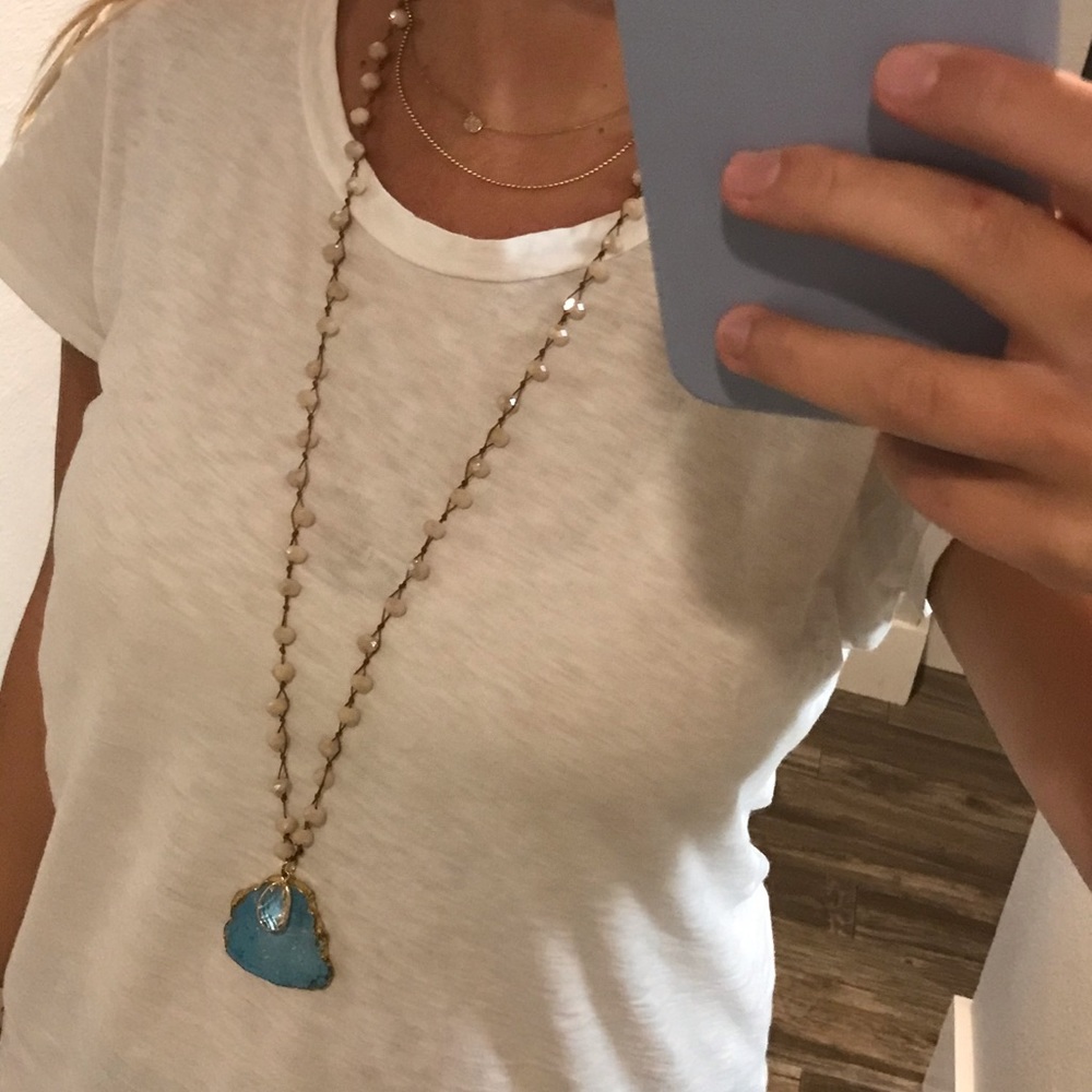 Beaded necklace with blue stone